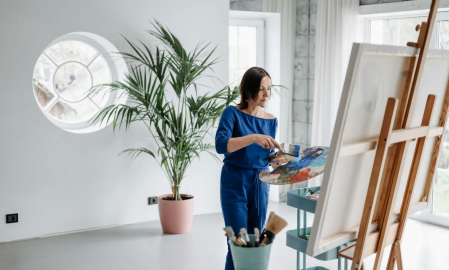 Student practicing figure drawing with charcoal and paper